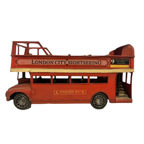 446 - Tin plate model “London City Sightseeing” bus. 32cm