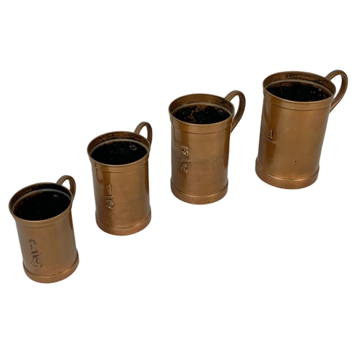 57 - 4 early 20th century French copper measures 16cm