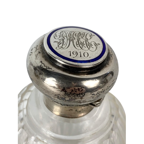 657 - Early 20th century sterling silver topped scent bottle. 13cm