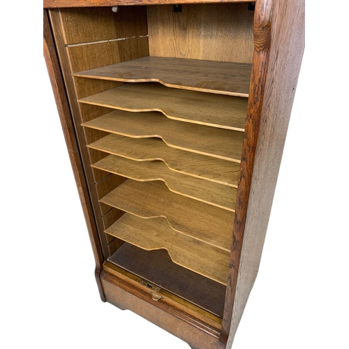 824 - Early 20th century oak sliding door filing chest. 48x41x91cm