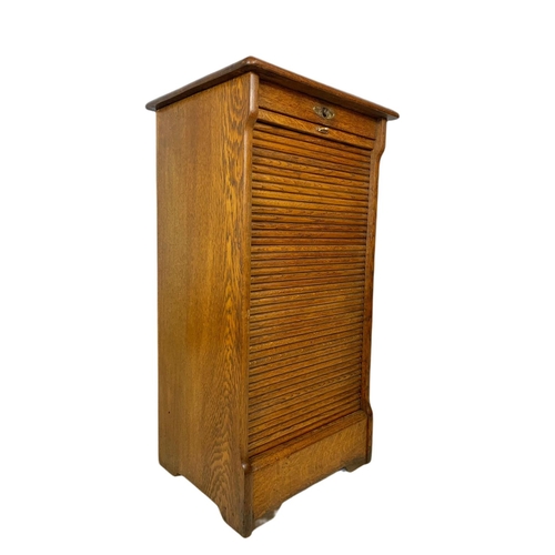 824 - Early 20th century oak sliding door filing chest. 48x41x91cm