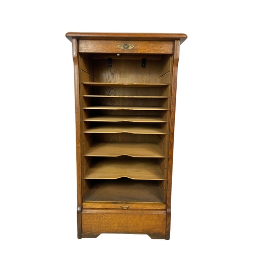 824 - Early 20th century oak sliding door filing chest. 48x41x91cm