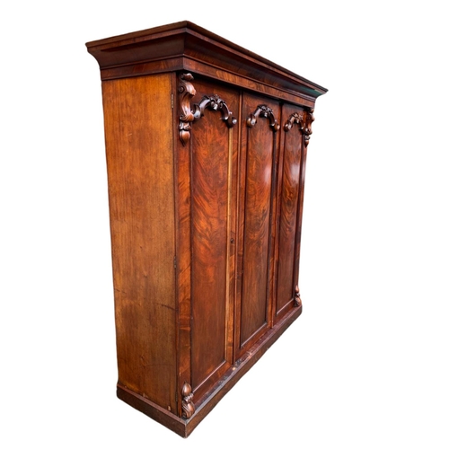 828 - Large Victorian carved mahogany 3 door wardrobe. 189x61x225cm