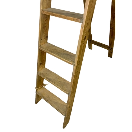 846 - Tall early 20th century wooden ladders. 190cm