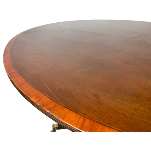 865 - Georgian inlaid tilt top pedestal dining table. 116.5x102x71cm