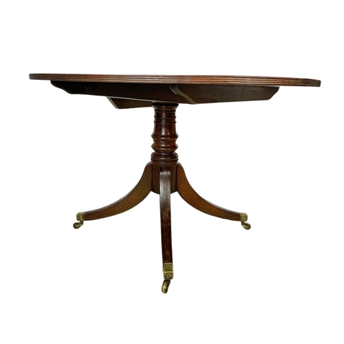 865 - Georgian inlaid tilt top pedestal dining table. 116.5x102x71cm