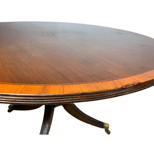 865 - Georgian inlaid tilt top pedestal dining table. 116.5x102x71cm