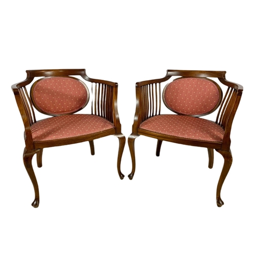 874 - Pair of Edwardian mahogany tub armchairs.