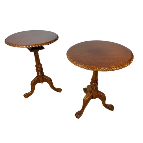 889 - Near pair of carved mahogany snap top pedestal side tables. Height of both 70cm and 66cm