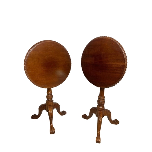 889 - Near pair of carved mahogany snap top pedestal side tables. Height of both 70cm and 66cm