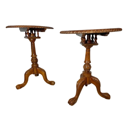 889 - Near pair of carved mahogany snap top pedestal side tables. Height of both 70cm and 66cm