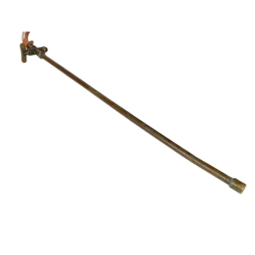 91 - Early 20th century copper garden weeder. 36/46cm