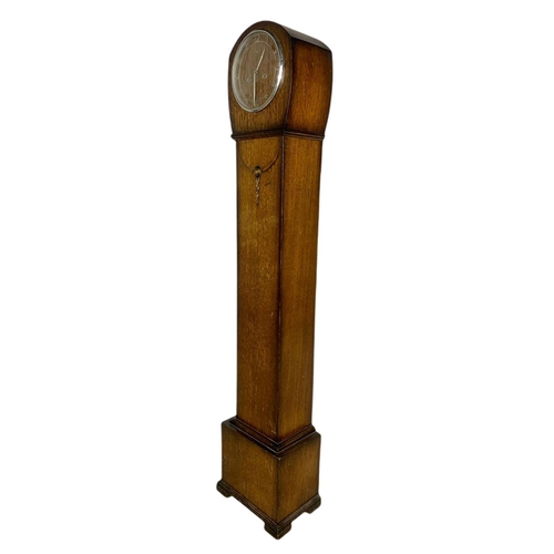 911 - 1930’s oak case granddaughter clock. 131.5cm