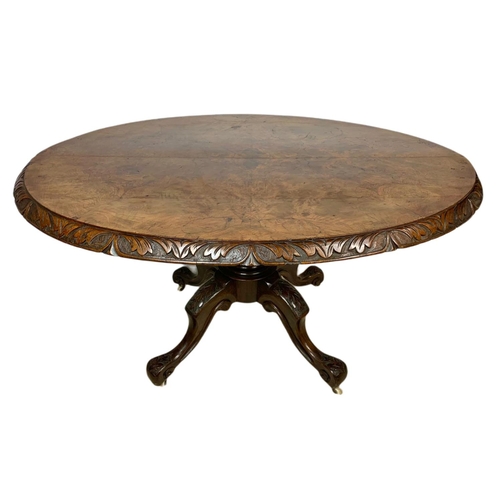 917 - Victorian carved walnut tilt top breakfast table. 138x100x73.5cm