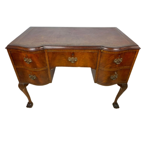 919 - 1930’s Chippendale style mahogany leather top desk with ball and claw feet. 106.5x65x77cm