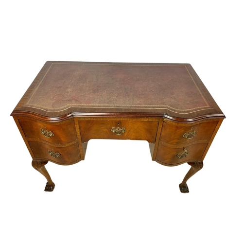 919 - 1930’s Chippendale style mahogany leather top desk with ball and claw feet. 106.5x65x77cm