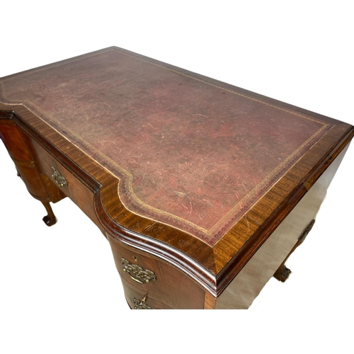 919 - 1930’s Chippendale style mahogany leather top desk with ball and claw feet. 106.5x65x77cm