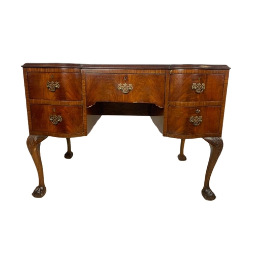 919 - 1930’s Chippendale style mahogany leather top desk with ball and claw feet. 106.5x65x77cm