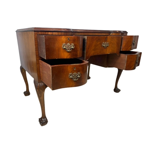 919 - 1930’s Chippendale style mahogany leather top desk with ball and claw feet. 106.5x65x77cm