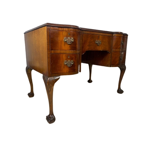 919 - 1930’s Chippendale style mahogany leather top desk with ball and claw feet. 106.5x65x77cm