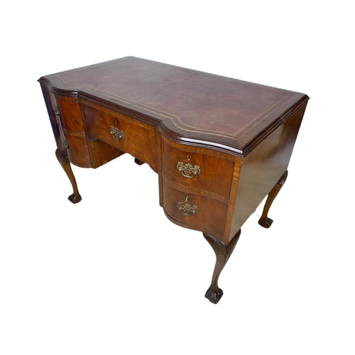 919 - 1930’s Chippendale style mahogany leather top desk with ball and claw feet. 106.5x65x77cm