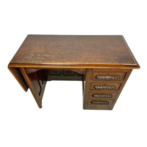 1015 - Edwardian oak drop leaf writing desk. Circa 1910 Extended 120x45.5x67cm