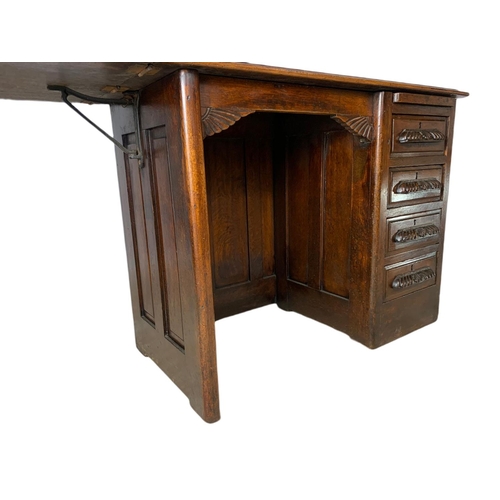 1015 - Edwardian oak drop leaf writing desk. Circa 1910 Extended 120x45.5x67cm