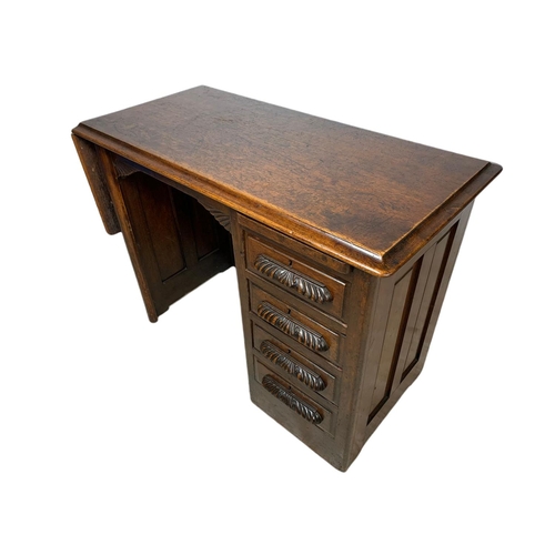 1015 - Edwardian oak drop leaf writing desk. Circa 1910 Extended 120x45.5x67cm