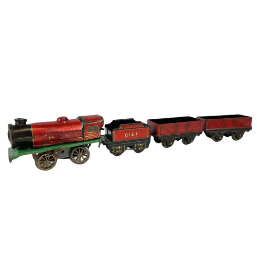 280 - Early 20th century Meccano tinplate wind up trains with tracks. Horney Series Hornby