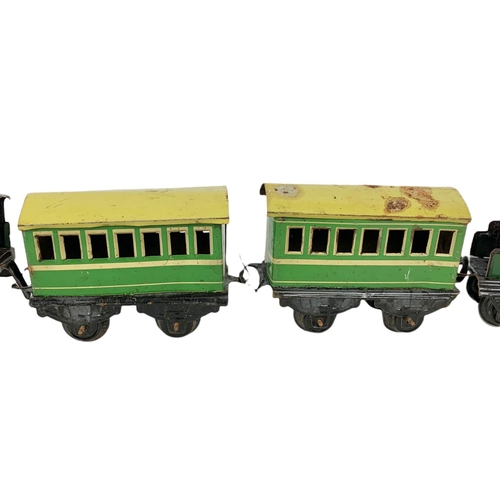 280 - Early 20th century Meccano tinplate wind up trains with tracks. Horney Series Hornby