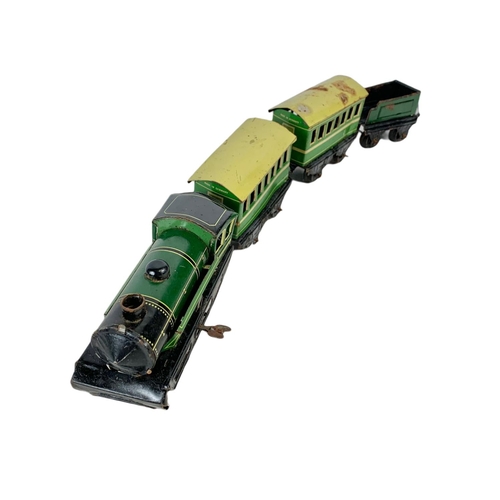 280 - Early 20th century Meccano tinplate wind up trains with tracks. Horney Series Hornby