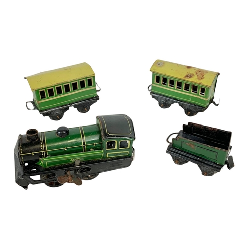 280 - Early 20th century Meccano tinplate wind up trains with tracks. Horney Series Hornby