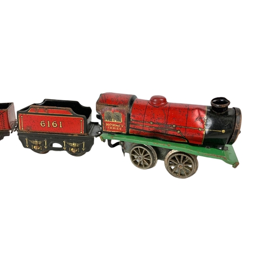 280 - Early 20th century Meccano tinplate wind up trains with tracks. Horney Series Hornby