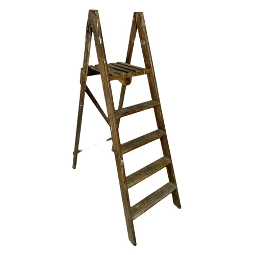 329 - 2 vintage wooden stepladders