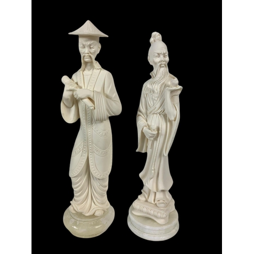 447 - 2 A. Giannetti Chinese figures on marble and slate bases. 28cm