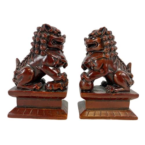 454 - Pair of small Chinese resin Foo Lions. 5/8/12cm