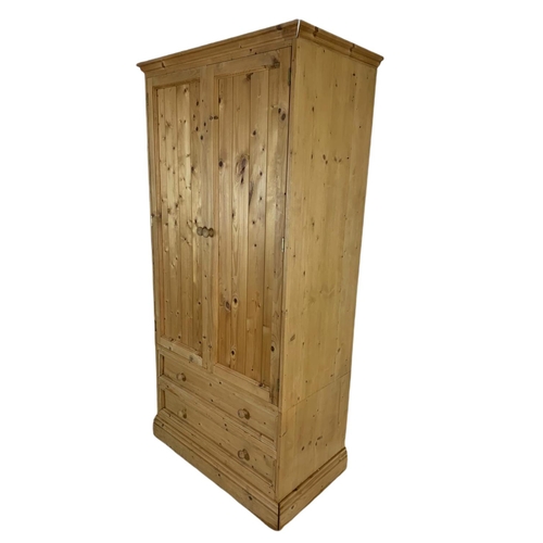 793 - 3 piece pine bedroom suite. 2 large wardrobes and a chest of drawers. Largest 84x52x206cm.