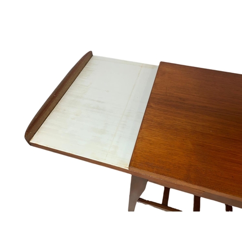 935 - Teak mid century coffee table with sliding trays. 96x46x44cm