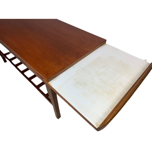 935 - Teak mid century coffee table with sliding trays. 96x46x44cm