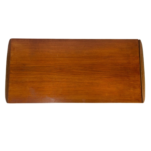 935 - Teak mid century coffee table with sliding trays. 96x46x44cm