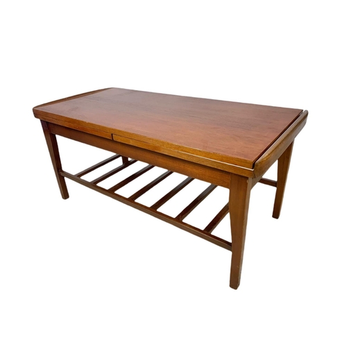 935 - Teak mid century coffee table with sliding trays. 96x46x44cm