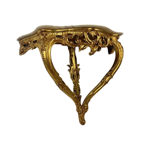 944 - 18th century style ornate gilt onyx top console table in the rococo style. 87x33x70cm