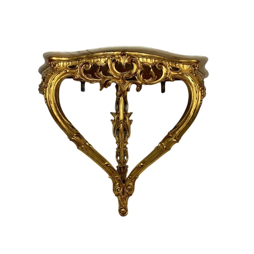 944 - 18th century style ornate gilt onyx top console table in the rococo style. 87x33x70cm