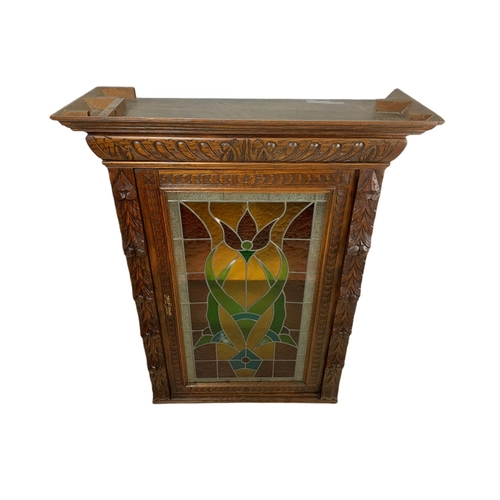 946 - Victorian carved oak wall hanging cabinet with stain glass door. 93/36/119.5cm