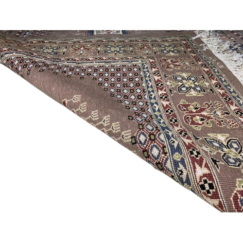 956 - Middle Eastern design hand sewn rug. 125.5x198cm