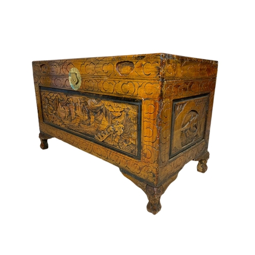 1036 - Ornate carved trunk. 100/50/61cm