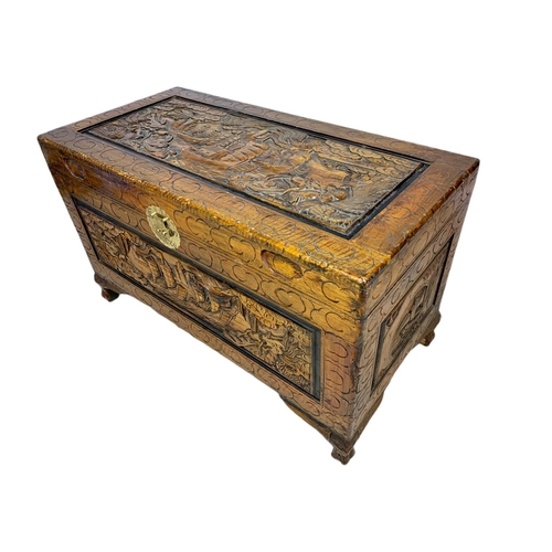 1036 - Ornate carved trunk. 100/50/61cm