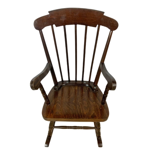 1039 - Small vintage rocking chair with an early 20th century copper fire screen