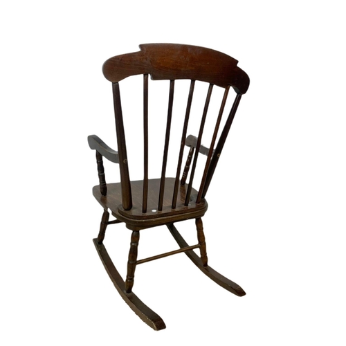 1039 - Small vintage rocking chair with an early 20th century copper fire screen