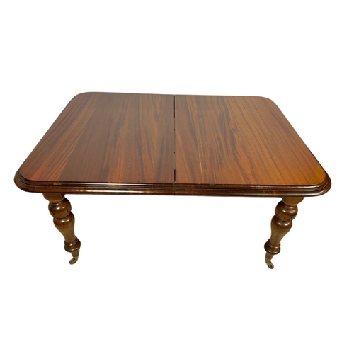 1050 - Victorian mahogany extendable 2 leaf dining table. Fully extended 216x105x74cm